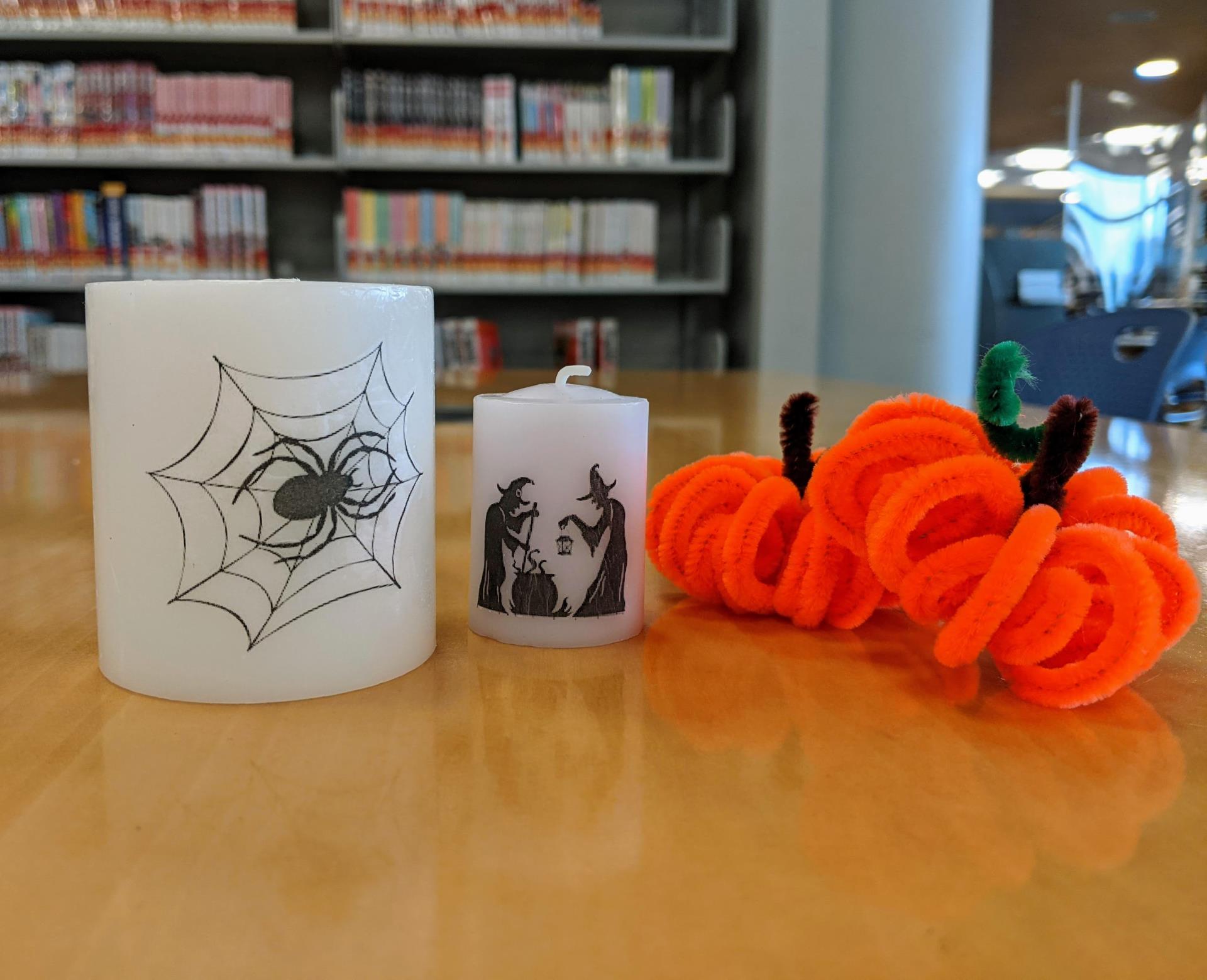 Image of candles with Halloween decorations on them