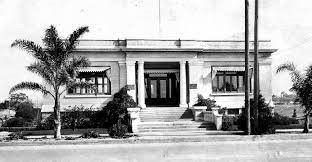 National City Public Library circa 1905, white one-floor Carnegie building with palm trees in front